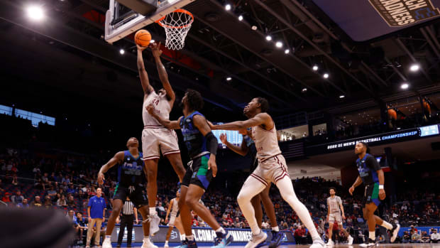 Mar 15, 2022; Dayton, OH, USA; Texas Southern Tigers forward Brison Gresham (44) goes to the basket pressured by Texas A&M-CC Islanders forward San Antonio Brinson (23) in the first half during the First Four of the 2022 NCAA Tournament at UD Arena. Mandatory Credit: Rick Osentoski-USA TODAY Sports